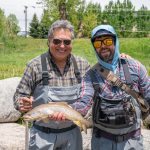 Vail fly fishing outfitter and client with prize trout