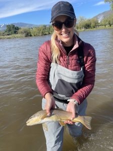 ERO - fly fishing Outfitter woman with nice trout
