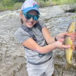 Thumbnail of http://12%20year%20old%20girl%20showing%20off%20her%20prize%20trout%20from%20the%20Eagle%20River%20fishing%20trip